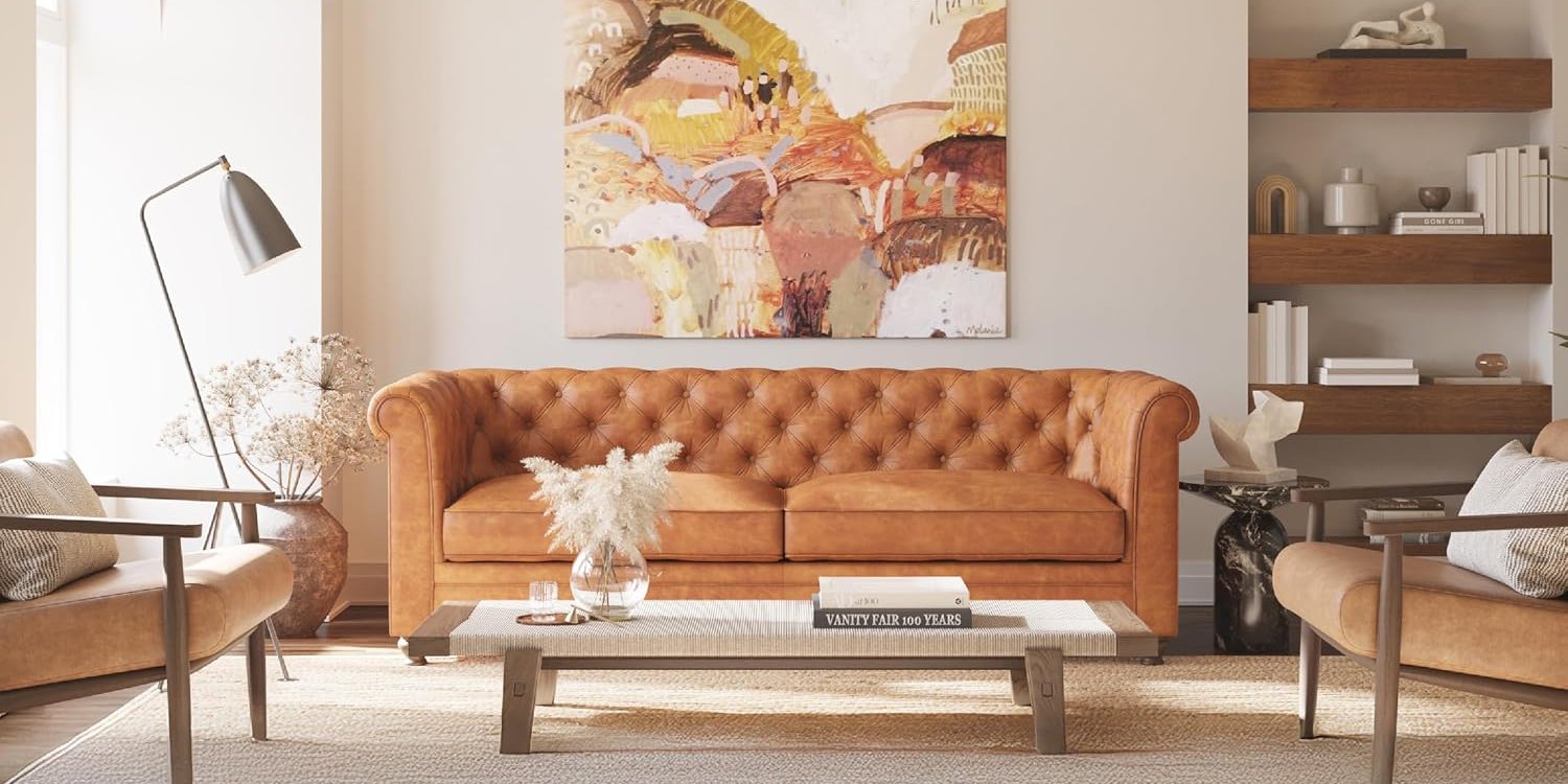Poly & Bark Lyon cognac leather Chesterfield sofa with button tufting in a living room with abstract art